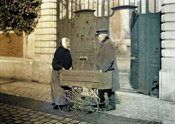 Two Senior Citizens of Reims, an Old Woman and Mr. Reiser, Standing in Front of a Gate with Many Bullet Holes, Reims, Marne, France, 1917